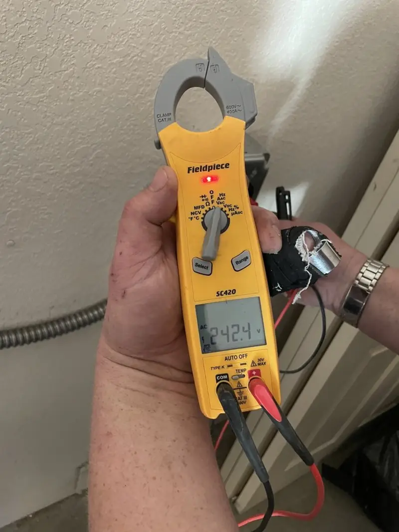 Voltage testing with clamp meter during Circuit Breaker Repair in Wrightsville